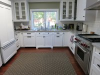 Kitchen after remodel.  New sink, countertop, backsplash and stove.